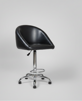 Black swivel chair with chrome base in a warehouse setting