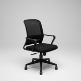 Black office chair in a modern office setting with a desk and plant.