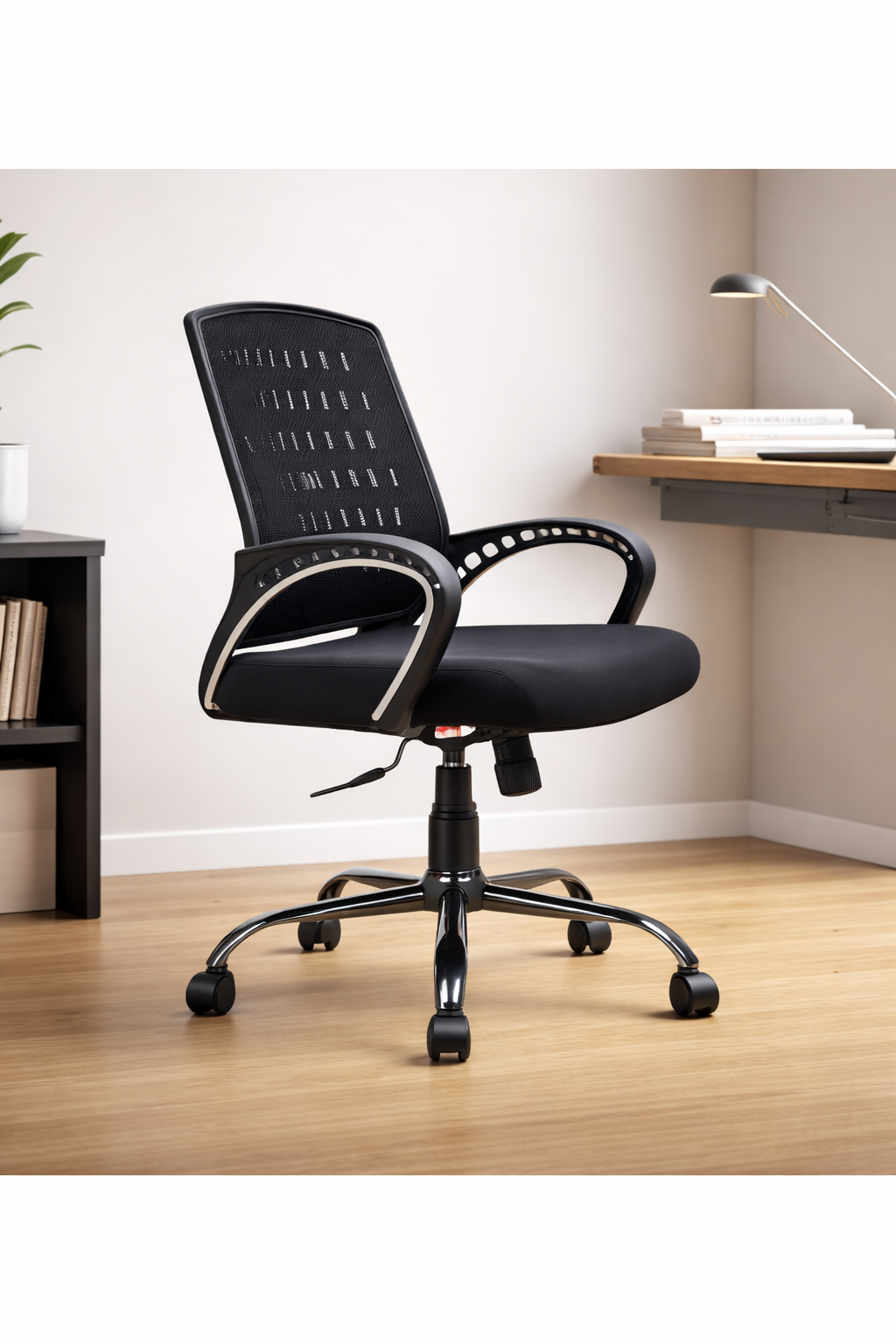 Black office chair in a room with a desk and books.
