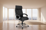 Black office chair in a home office setting with a desk and computer.