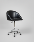 Black swivel chair with chrome base in a warehouse setting