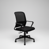 Black office chair in a modern office setting with a desk and plant.